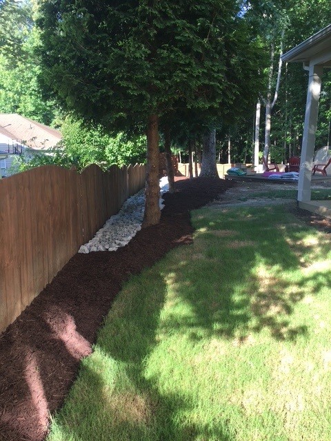 Mulch and drainage work completed by KEEN